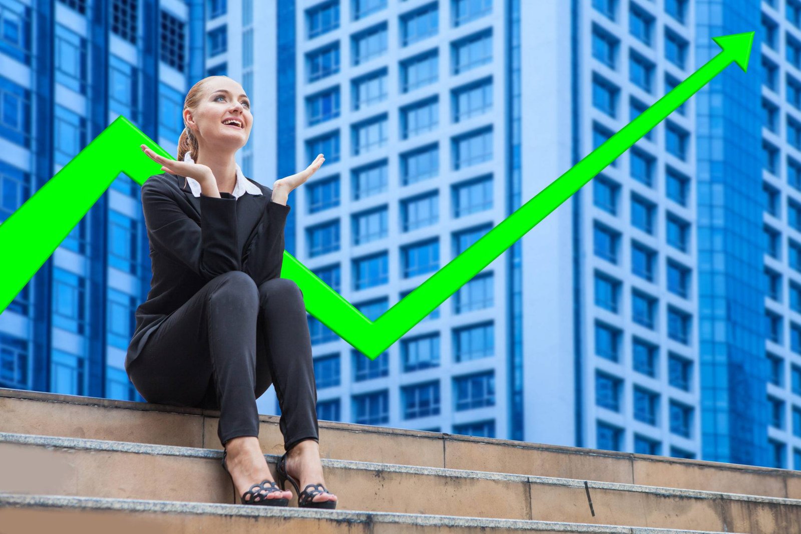 Woman sitting on steps in front of a green rising chart arrow and office towers