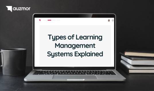 Laptop on a desk showing the title Types of Learning Management Systems Explained