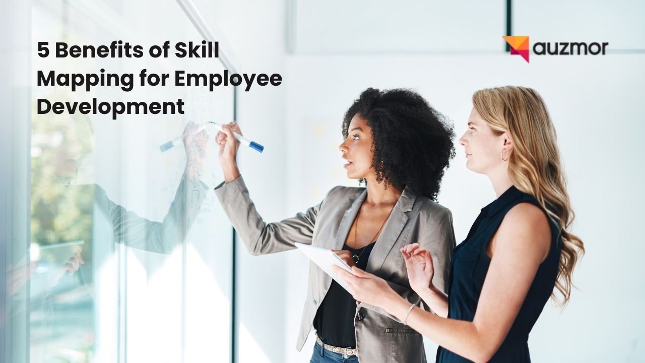 Two colleagues writing on a glass board, with the title 5 Benefits of Skill Mapping for Employee Development