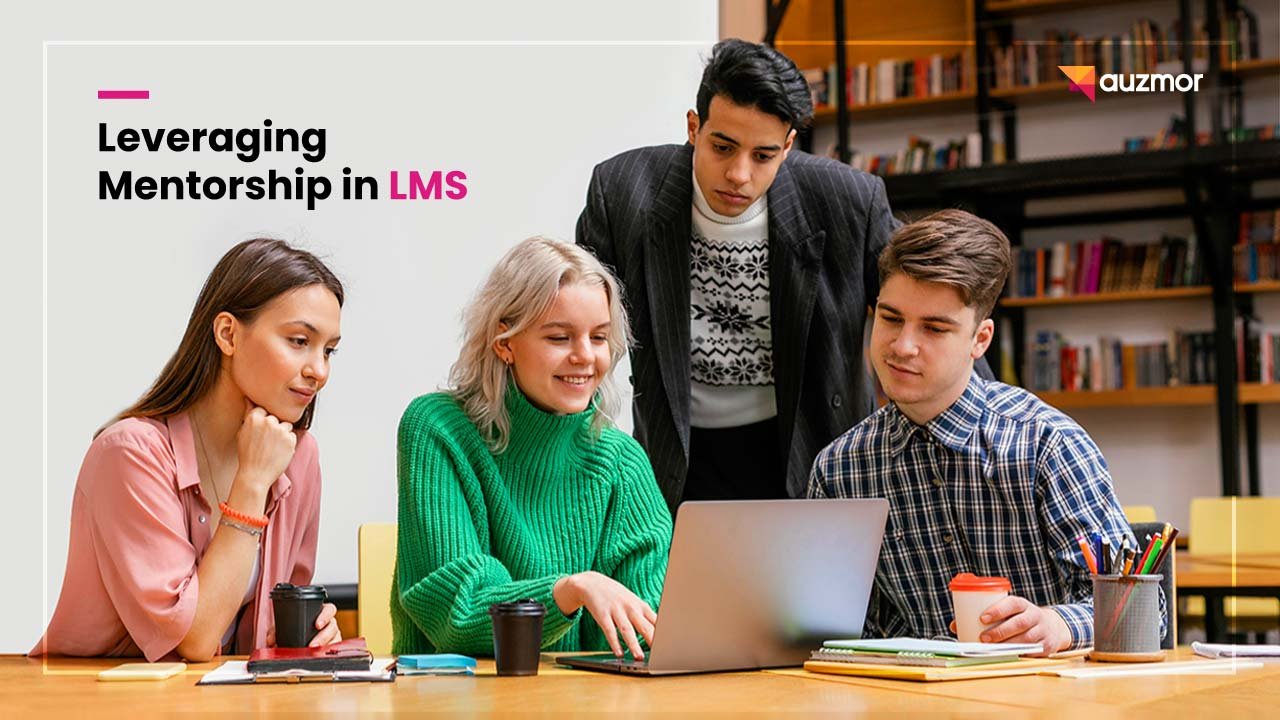 Group of young colleagues gathered around a laptop, with the title Leveraging Mentorship in LMS