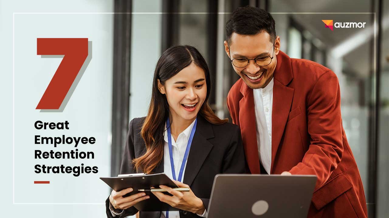 Two smiling colleagues looking at a clipboard and laptop, with the title 7 Great Employee Retention Strategies