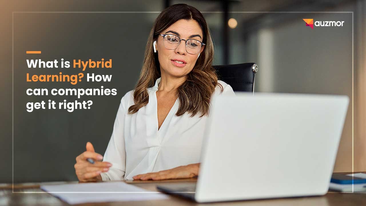 Woman in glasses smiling at a laptop, with the title What is Hybrid Learning? How can companies get it right?