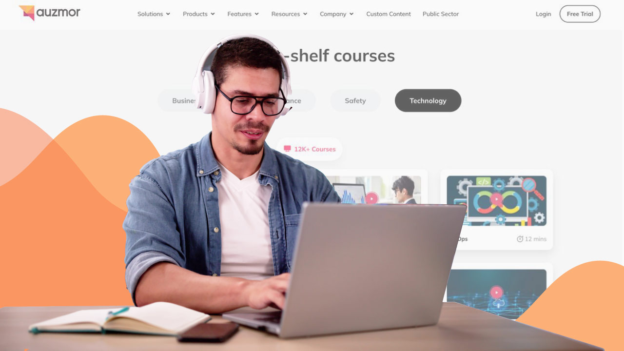 Man with headphones at a laptop browsing off-the-shelf technology courses