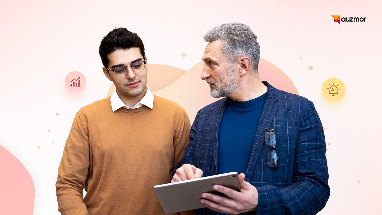 Mentor showing performance insights on a tablet to a younger colleague