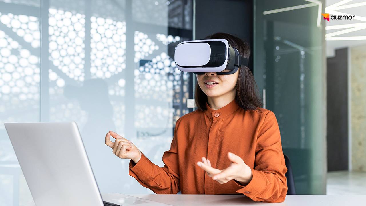 Woman wearing a VR headset in an immersive training session at a laptop