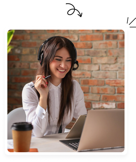 Smiling Auzmor support agent wearing a headset, helping a customer from her laptop