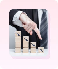 Wooden blocks with falling arrows representing revenue lost to non-compliance