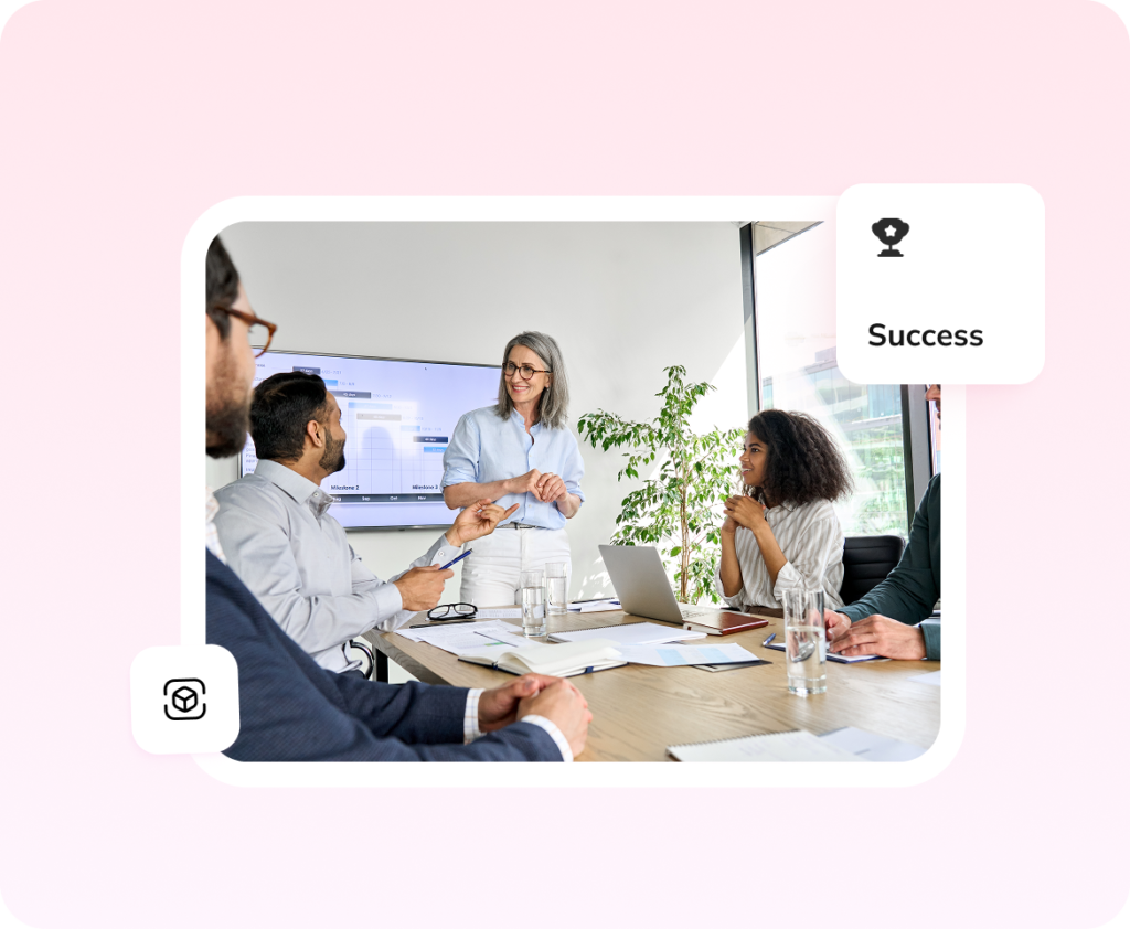Leader presenting to colleagues in a meeting, representing the Leadership Transformation Initiative case study