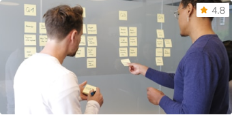 Two colleagues planning with sticky notes, thumbnail for the AI for Business Leaders course