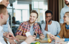 Auzmor team members working together at a table