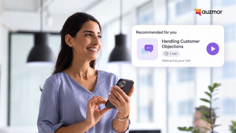 Smiling employee holding a phone with a recommended two-minute lesson on handling customer objections