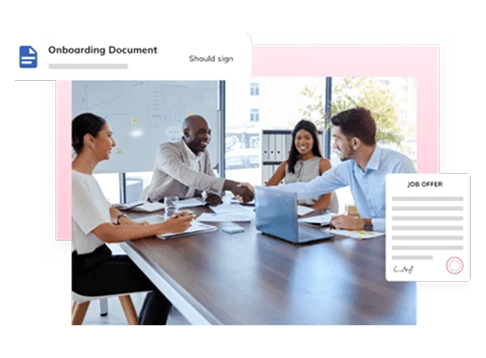 Team meeting around a conference table with an onboarding document and job offer card