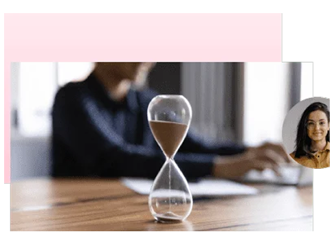 Hourglass on a desk beside a person working, with a learner profile photo