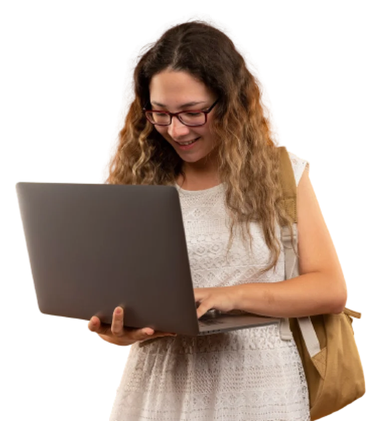 Smiling woman with glasses reading on a laptop