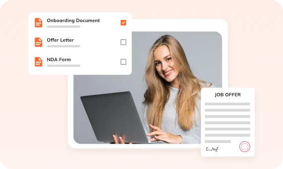 Smiling candidate with a laptop beside onboarding documents and a signed job offer in Auzmor Hire