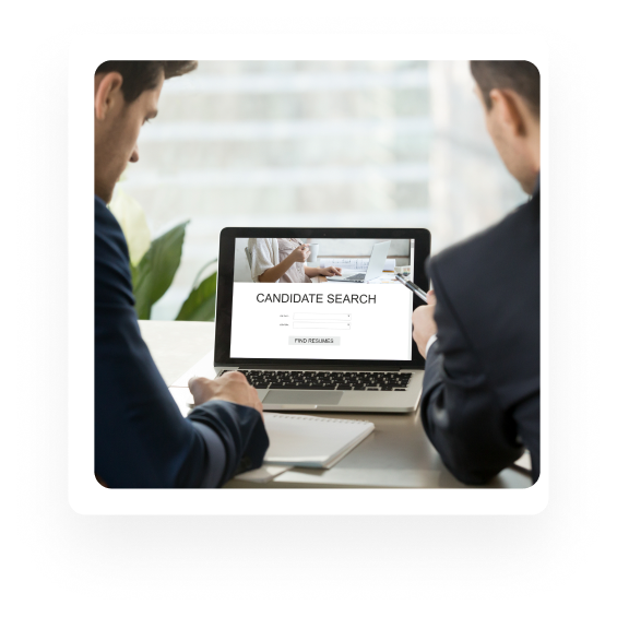Recruiters reviewing a candidate search on a laptop
