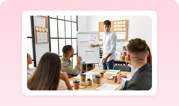 Instructor leading a group lesson at a whiteboard