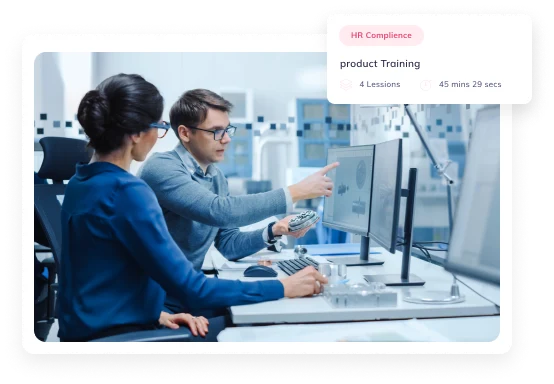 Engineers reviewing product data on monitors beside an HR compliance product training card